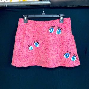 ANNA K - sz 4-6 anime mini skirt w/single Pocket & back zip in pink w/ doll eyes